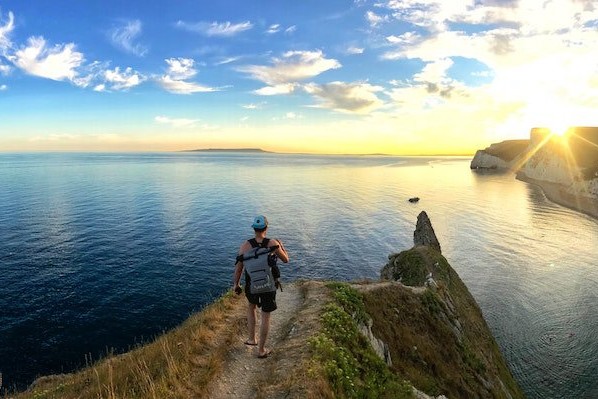 Coastal Walks - man on top of cliff
